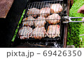 Grilling meat steaks. Juicy meat chops are grilled 69426350