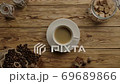 Coffee service. Woman's hand puts a stylish cup of black coffee with crema with chocolate bars 69689866