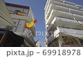 Glide shot of Spanish flag waving in the wind 69918978