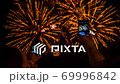 Two Persons Making Video Of Fireworks Using Smartphones 69996842