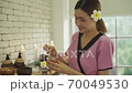 Young beautiful women are mixing skincare products from honey. 70049530