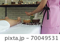 Young beautiful woman doing traditional massage in spa beauty salon 70049531