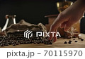 Comic human figure played by fingers walking over roasted coffee beans. Concept 70115970