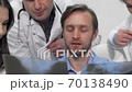 Sliding cropped shot of medical team examining x-ray or MRI scan together 70138490
