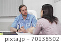 Mature male doctor comforting his upset female patient after bad news 70138502