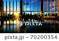 Young woman silhouette with suitcase walking in airport against beautiful sunset Young woman silhouette with suitcase walking in airport against beautiful sunset 70200354