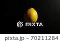 TOP VIEW: Lemon rotates on a black surface - Stop motion 70211284