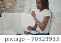 Millennial african ethnic woman student using laptop leaning at home, mixed race disciple distance education typing on notebook 70323933