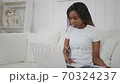 Distance education. Teen african girl student study online with internet teacher talk by webcam looking at laptop, teenager make video call 70324237
