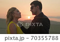 Romantic couple in love at sunset,love in the sun.Cuddling couple 70355788