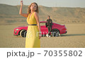 fashion blonde model in yellow clothes posing in the desert,dried wood,sunny day,a guy and a girl in yellow clothes in the desert 70355802