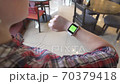 Smart watch with green screen. Person uses electronic device on the hand. New technologies 70379418