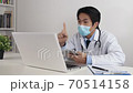 Asian Doctor Wear Face Mask Exam Patient by Tablet and Laptop via Video Chat 70514158