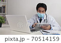 Asian Doctor Wear Face Mask Online Meeting or Video Conference by Tablet and Laptop 70514159