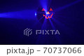 pumpkin disco ball with blue rays in fog at Halloween party, loop-ready blue background, 4k DCI footage 70737066
