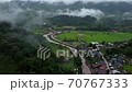A view of the rice fields in the morning And a small village 70767333