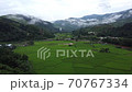 A view of the rice fields in the morning And a small village 70767334