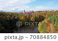 Aerial view of Czocha Castle surrounded by autumn forest and Lesnianskie Lake 70884850