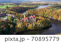 Aerial view of Czocha Castle surrounded by autumn forest and Lesnianskie Lake 70895779