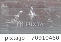 Raining heavily in the street 70910460