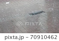 Raining heavily in the street 70910462