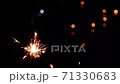Slow video clip of a yellow scab splashing from fireworks and Black background with blurry light. 71330683