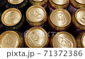 Minsk, Belarus - 16 September, 2020 - 4k Aluminium beer cans camera moving top view sideways. Group of golden beer cans industry business.  71372386