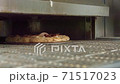 Pizza is cooked in the oven, it glides through the oven 71517023