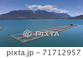 Aerial salmon farms at Reloncavi marine strait at Llanquihue National Park, Chile, South America. 71712957