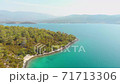 Pure nature with incredible clear green waters on a summer day in Didim, Turkey 71713306