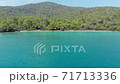 Aerial drone view over the coastline surrounded by green nature and Aegean sea waters in a secret bay in Akbuk, Didim, Turkey 71713336