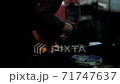 Grinding metal with a grinder. The blacksmith works with metal. Blacksmithing craft. 71747637