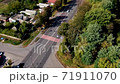 Crosswalk on the road. Top view on pedestrian crossing and highway. Drone shot on street with cars. 71911070