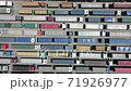 Pattern of trucks waiting in line for unloading at the port. Quadcopter flight along the parking lot of trucks, Transportation concept. 71926977