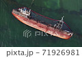 Old rusty ship sunk on the Sea on the beach. Tanker from aerial view on the background of the emerald sea. Oil pollution 71926981