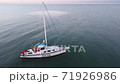 06.07.2020 Skadovsk, Ukraine. A small yacht with the Ukrainian flag in the Black Sea. 71926986
