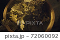Close up view of oak broom in wooden tub in bath with hot steam from water on black background in slowmotion 72060092