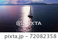 Boating in open sea with beautiful crystal wather and islands on the horizon. 72082358