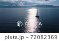 Romantic view of beautiful boat on the sea and majestic mountains in sunlight. 72082369