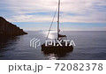 Boat harbour with boat on crystal water at the bottom of rocks. 72082378