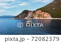 Romantic view of beautiful boat on the sea and majestic rocks in sunlight. 72082379