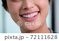 Close up smiling Asian woman mouth shows healthy white teeth with beautiful lips 72111628
