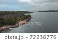 Green forest and steep rocks of Croatia. Stony coast of Golden Cape in Adriatic Sea 72236776