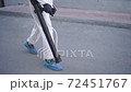 Cleaner with pressurized sprayer in hands going to disinfect public places 72451767