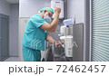 Sterility, cleanliness concept. male doctor washing hands before surgery. 72462457