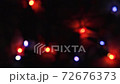 Red, green, blue and yellow lights on New Year garland. Concept of the home decoration. Slow motion 72676373