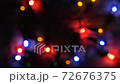 Red, green, blue and yellow lights on New Year garland. Concept of the home decoration. Slow motion 72676375