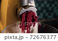 Meat minced in the electric meat grinder. Fresh minced meat. Close up. The process of cooking cutlets. 72676377