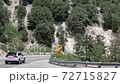 Car on Road Under Hills of Big Bear Mountain, California USA 72715827