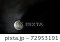 Full moon on a black sky with clouds passing 72953191